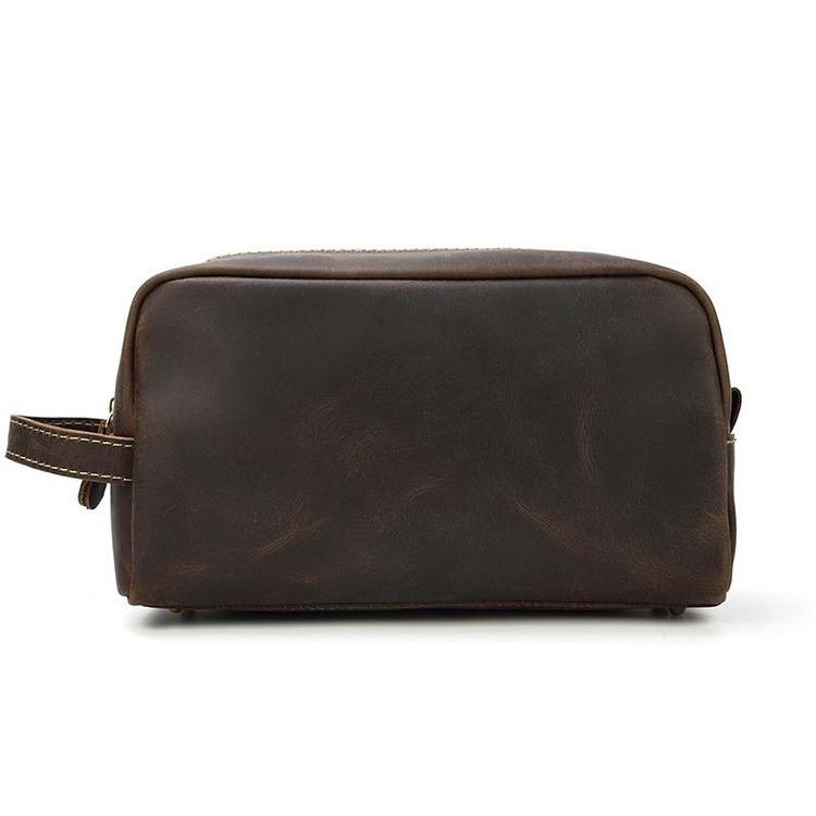 a brown leather bag with a strap