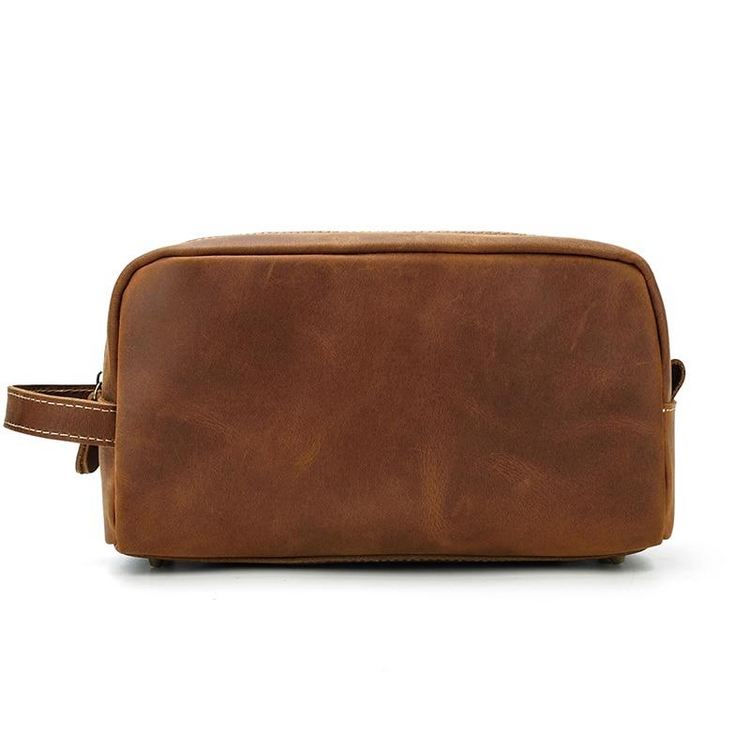 a brown leather bag with a handle