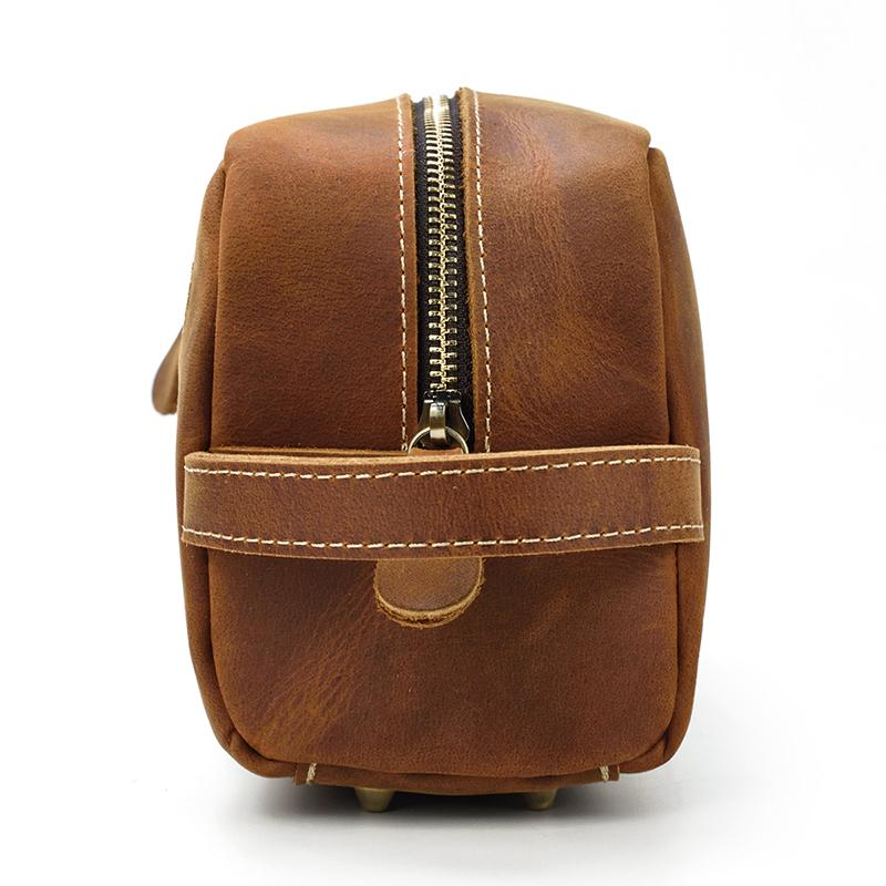 a brown leather bag with a zipper