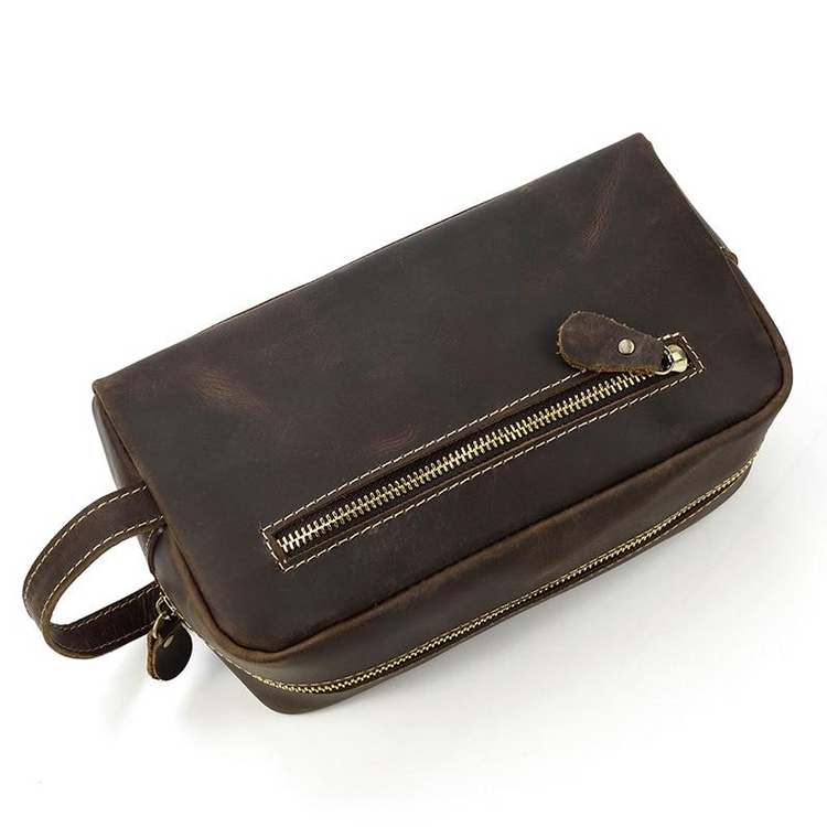 a brown leather bag with a zipper