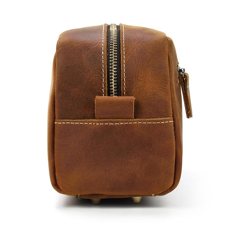 a brown leather bag with a zipper