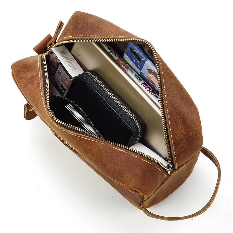 a brown bag with a wallet and a phone inside