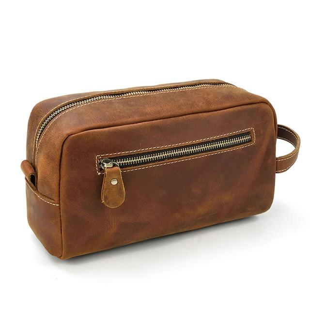 a brown leather bag with a zipper