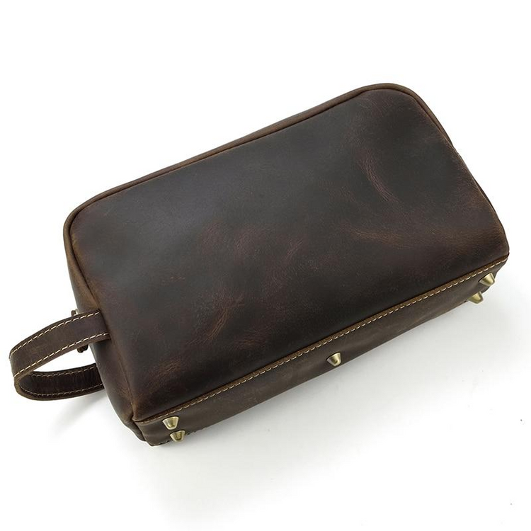a brown leather bag with a handle