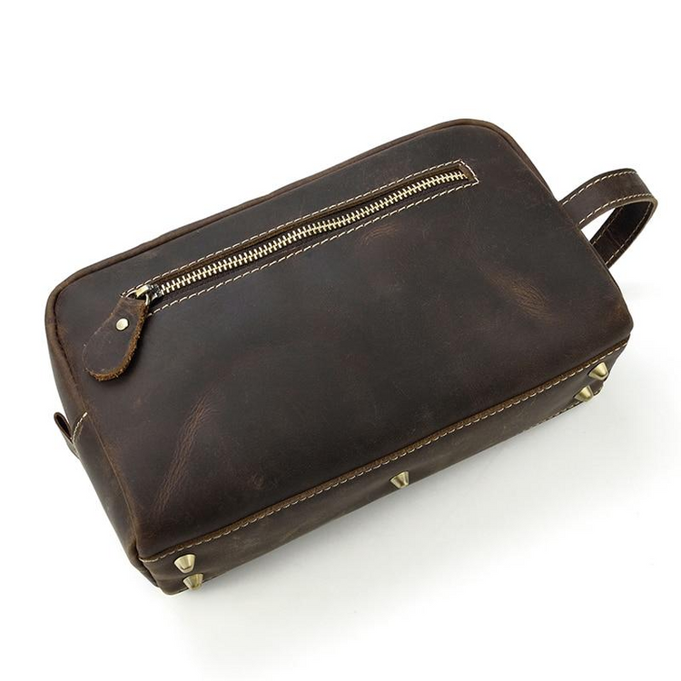 a brown leather bag with a zipper