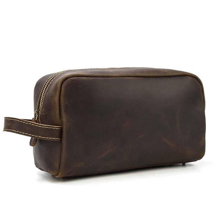 a brown leather bag with a handle