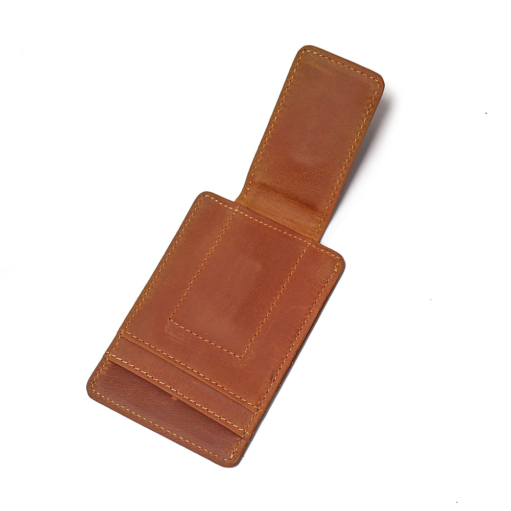 a brown leather wallet with a clip