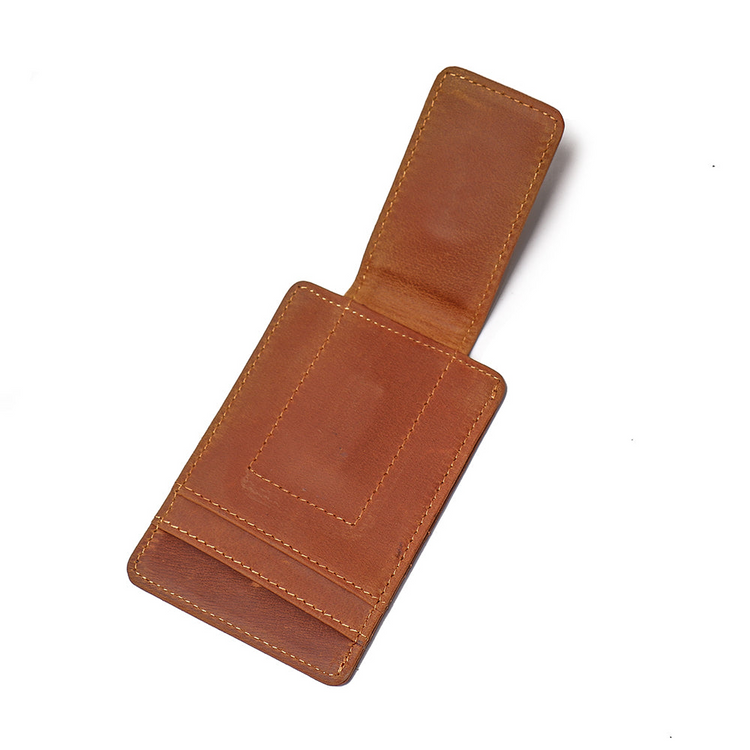 a brown leather wallet with a clip