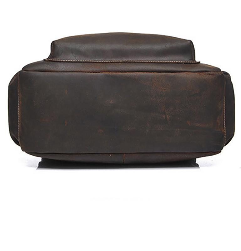 a brown leather bag on a white background