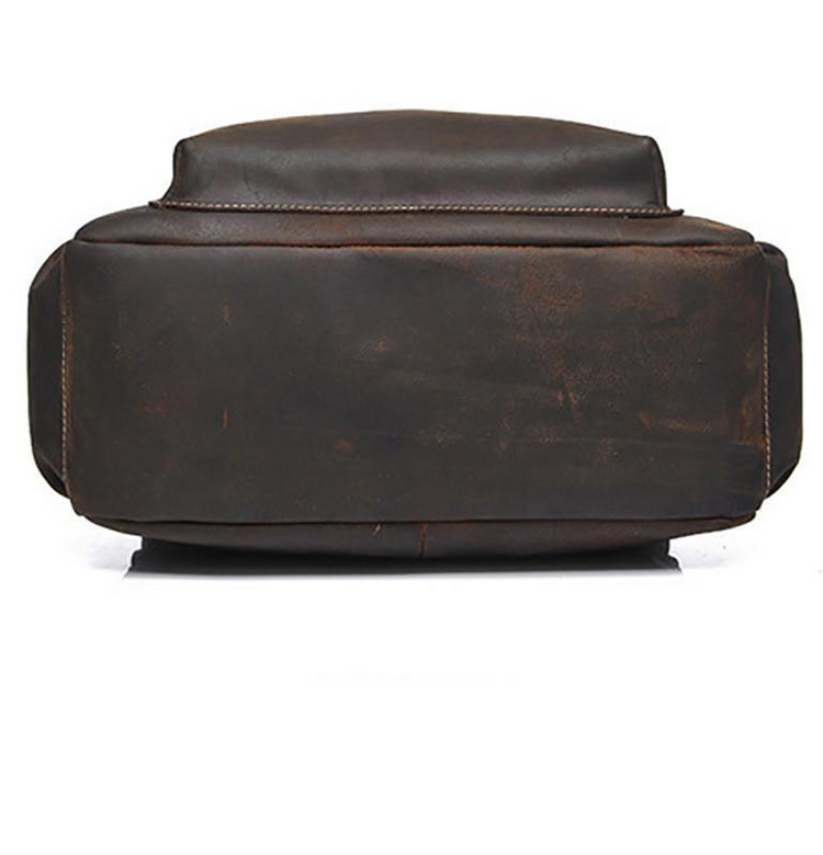 a brown leather bag on a white background