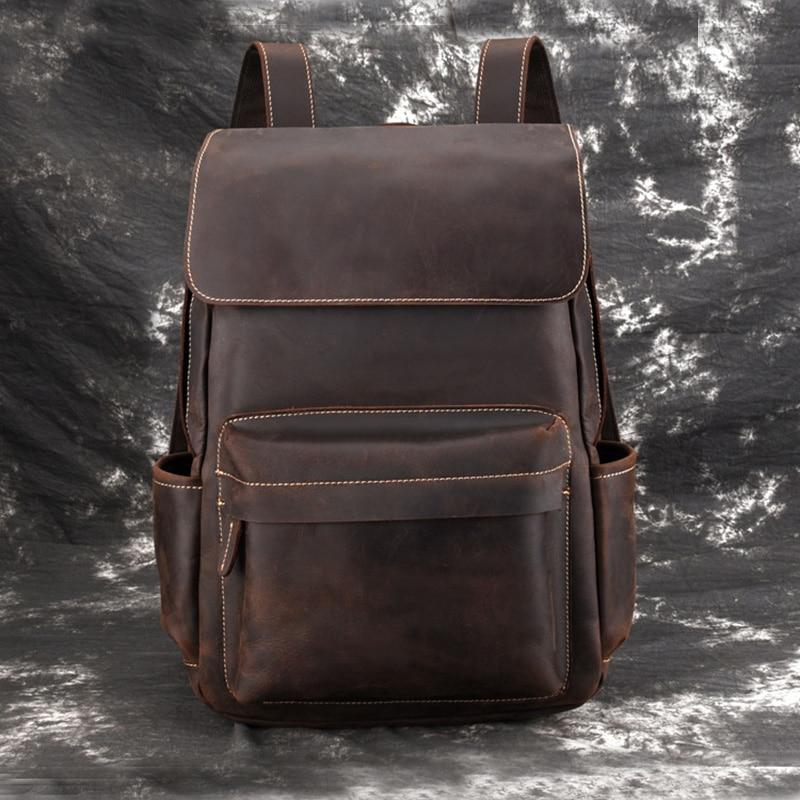 a brown backpack on a grey surface