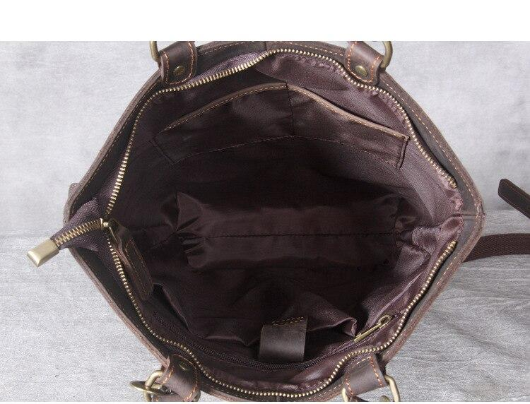 a brown purse with gold handles