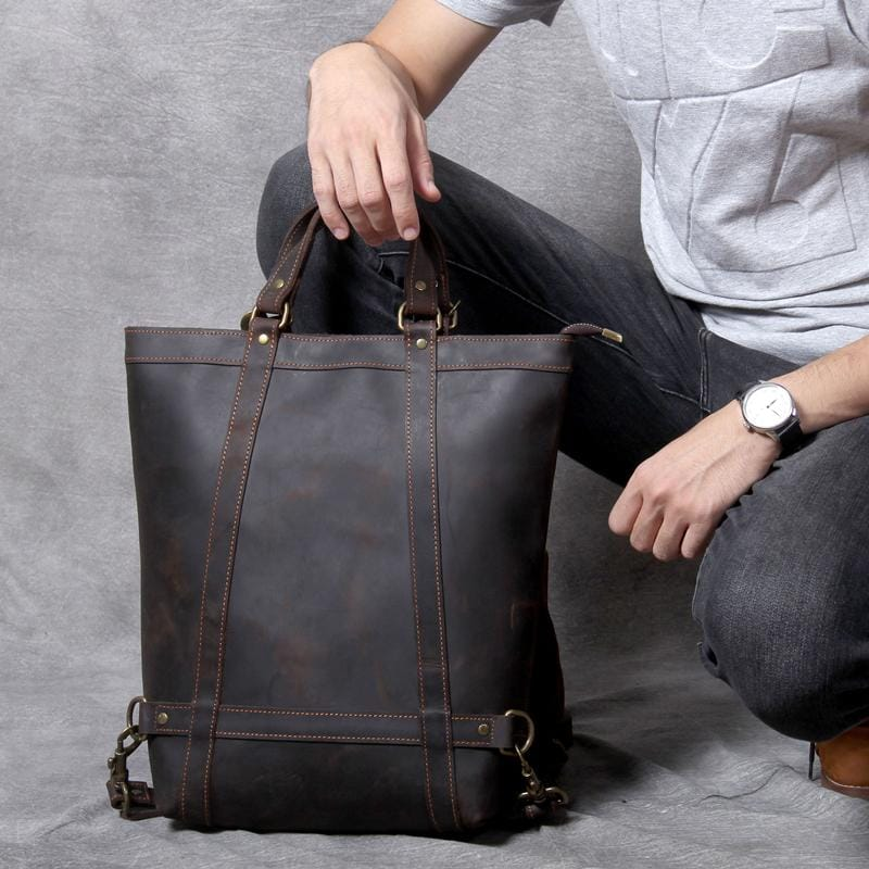 a person sitting on the floor holding a bag