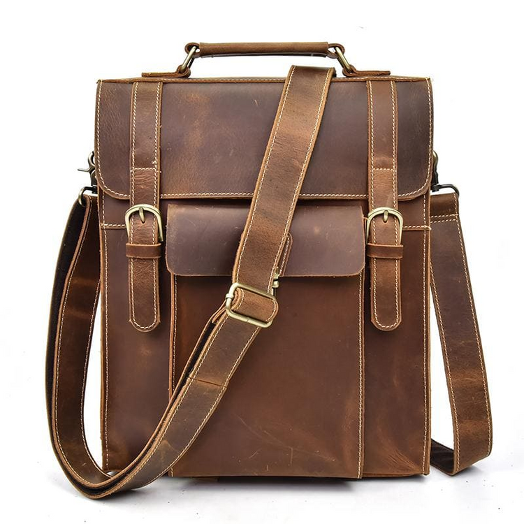 a brown leather bag with straps