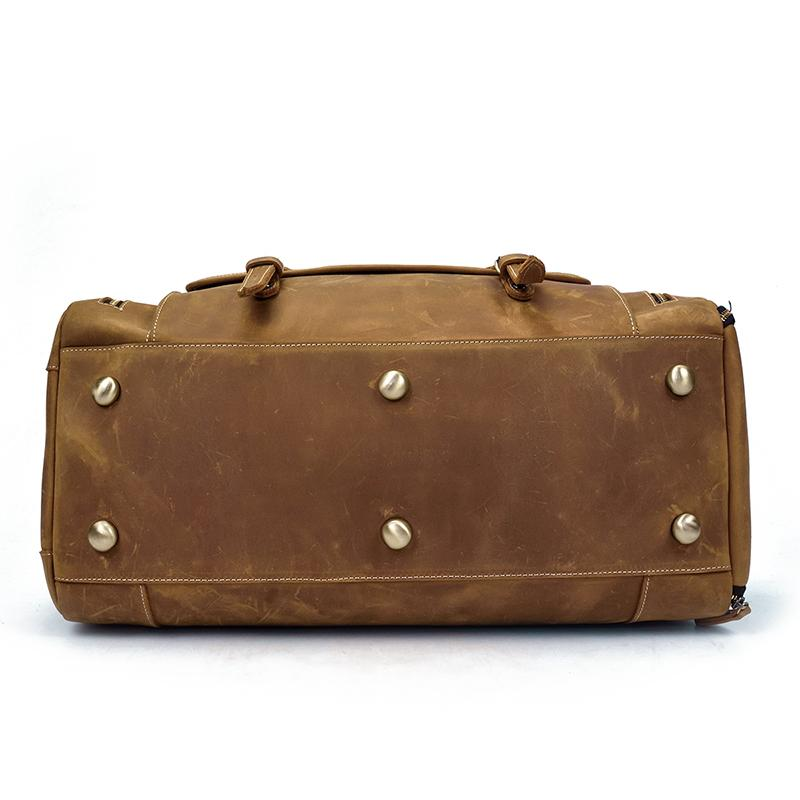 a brown leather bag with metal studs