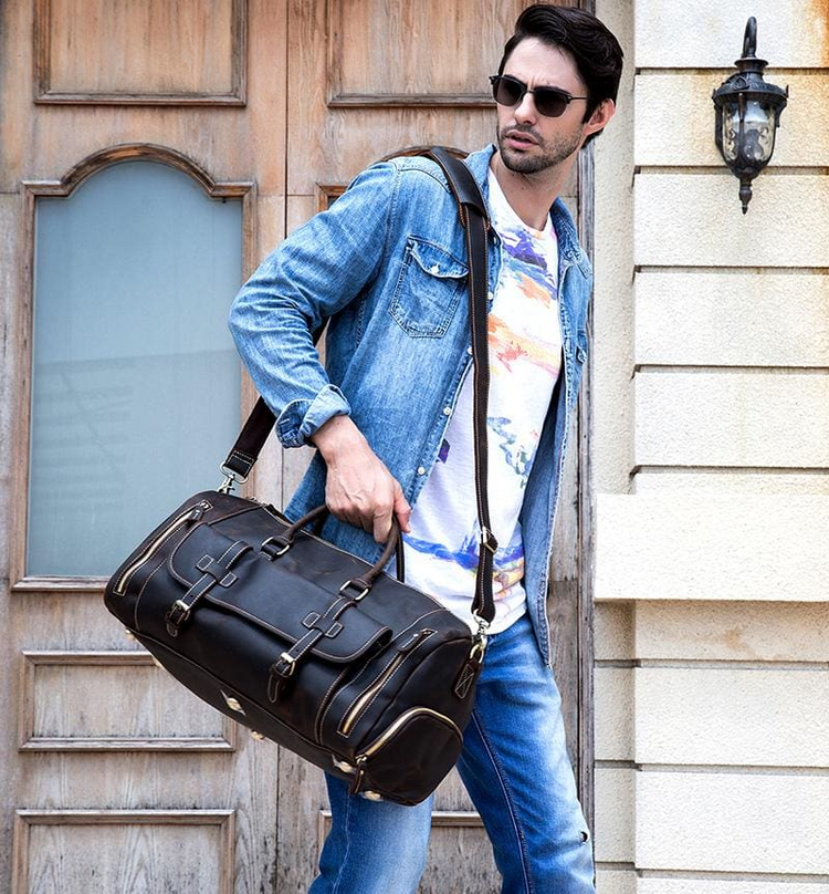 a man carrying a bag