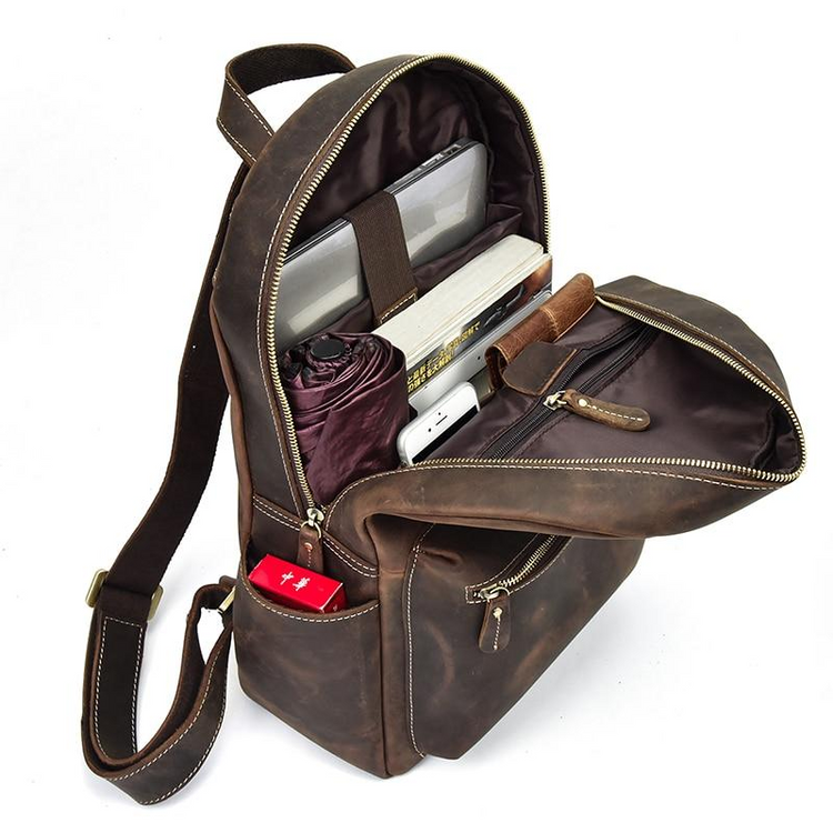 a brown backpack with a bag inside
