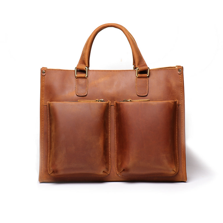 a brown leather bag with pockets