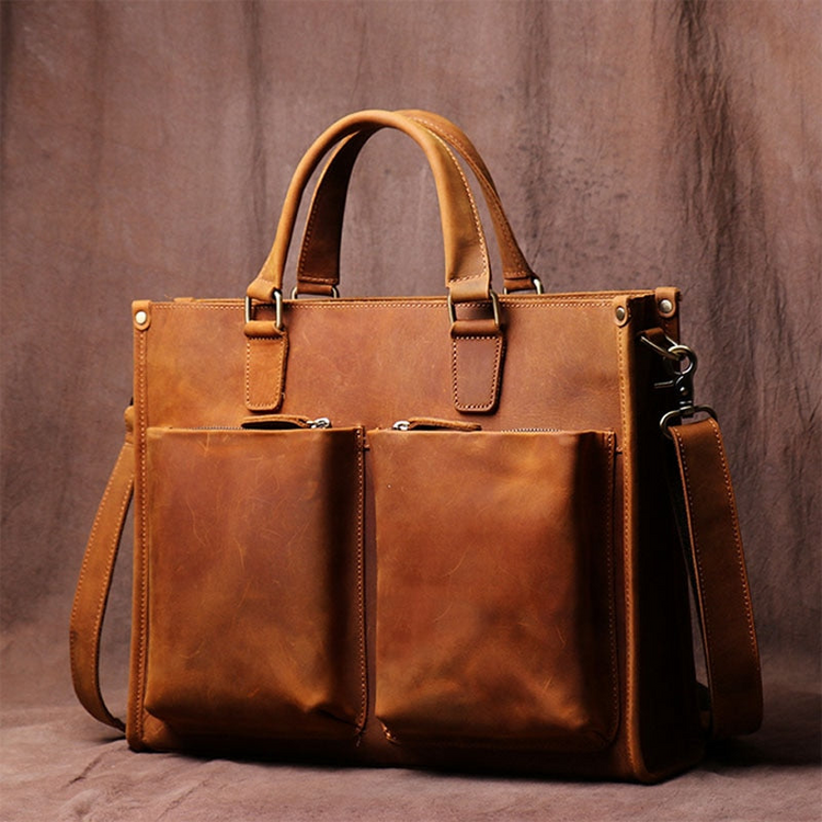 a brown leather bag with pockets