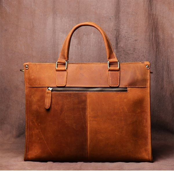 a brown leather bag with a handle
