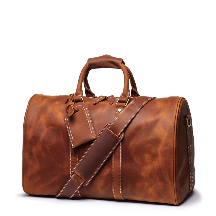 a brown leather bag with a strap