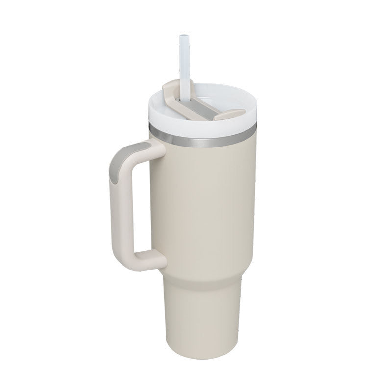 a white and grey coffee mug with a straw