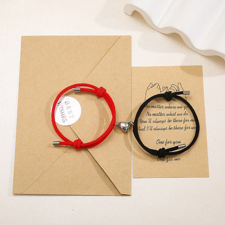 a pair of bracelets on a brown envelope