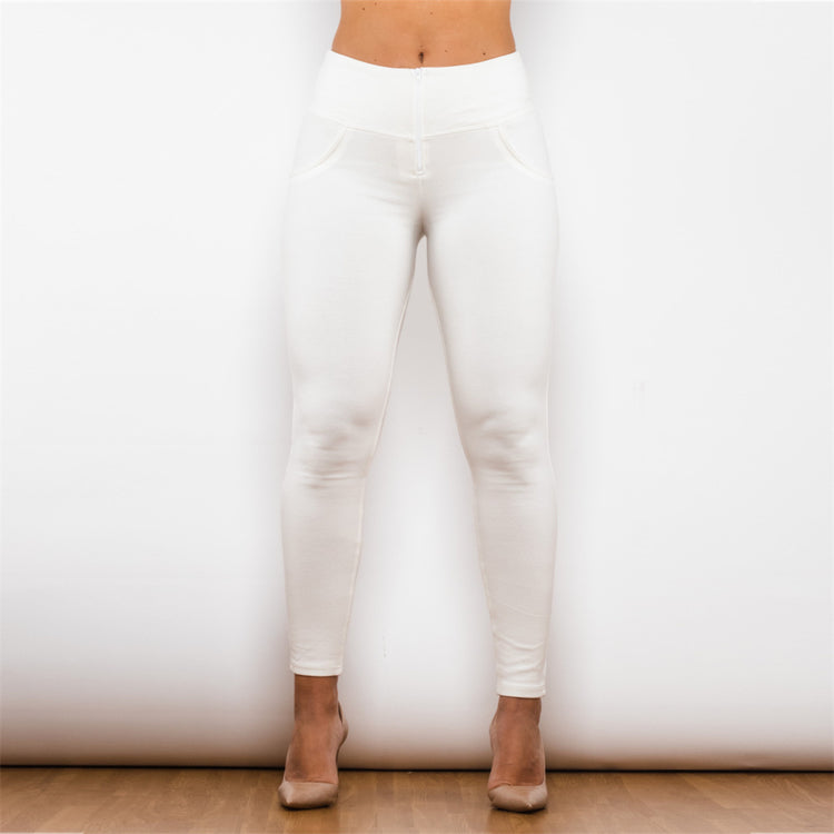a woman wearing white pants
