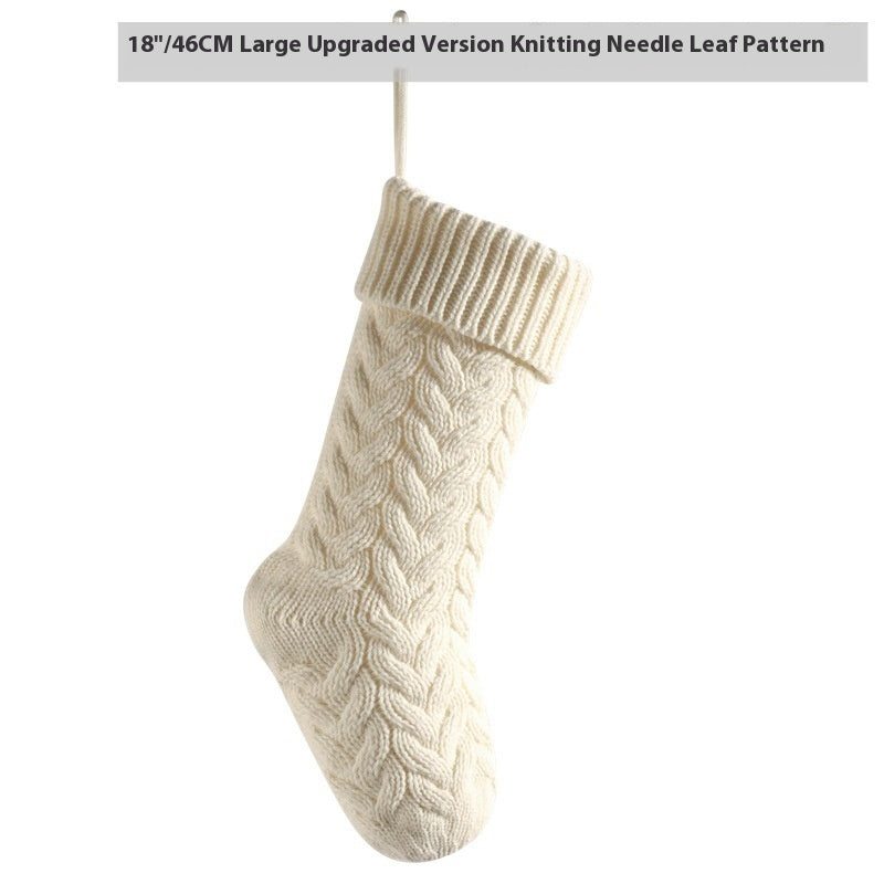 a white knitted sock from a string