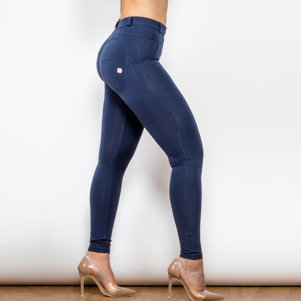a woman wearing tights and heels