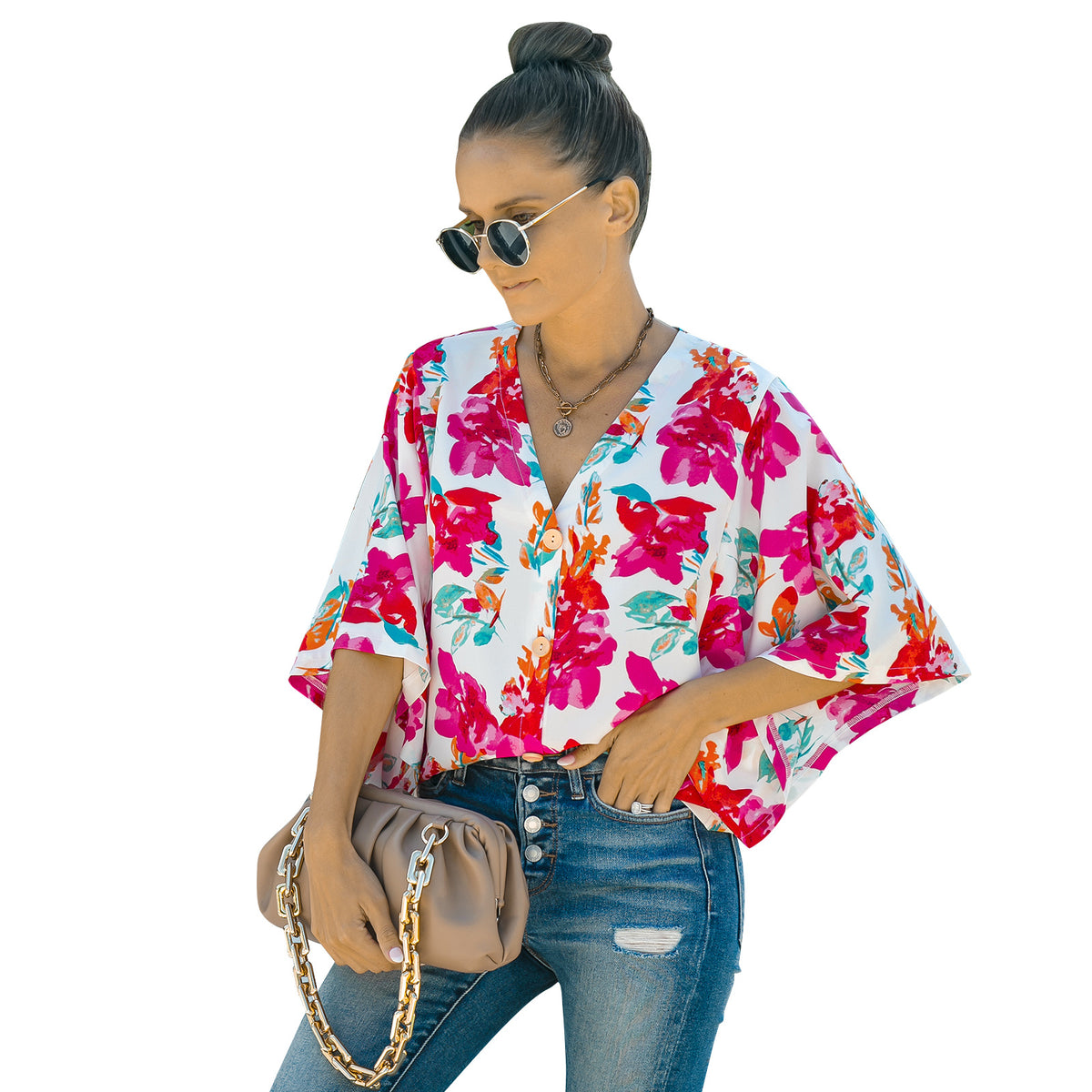 a woman wearing sunglasses and a floral shirt