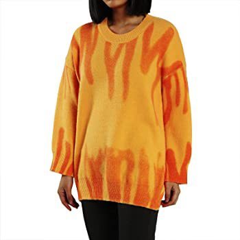a woman wearing a sweater