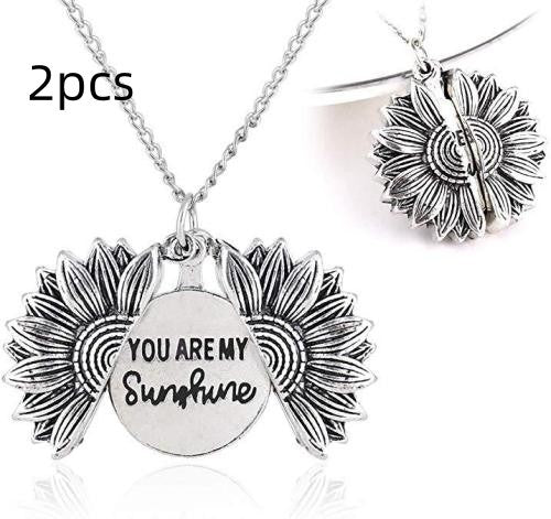 a necklace with sunflowers and words