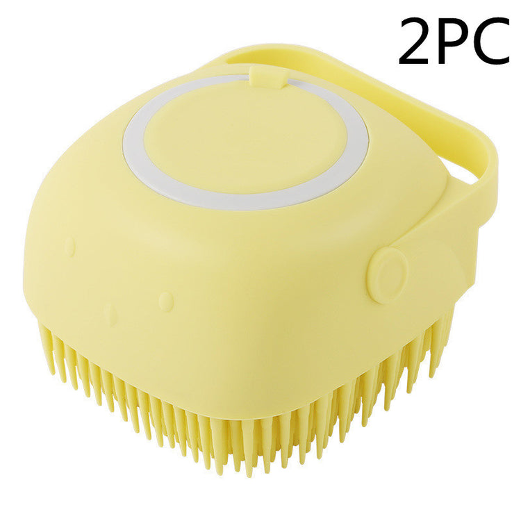 a yellow brush with a white handle