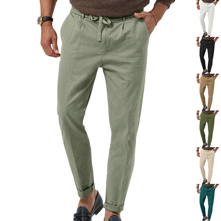 a man wearing pants and a sweater