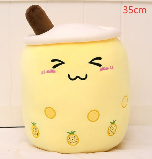a yellow plushie with a face