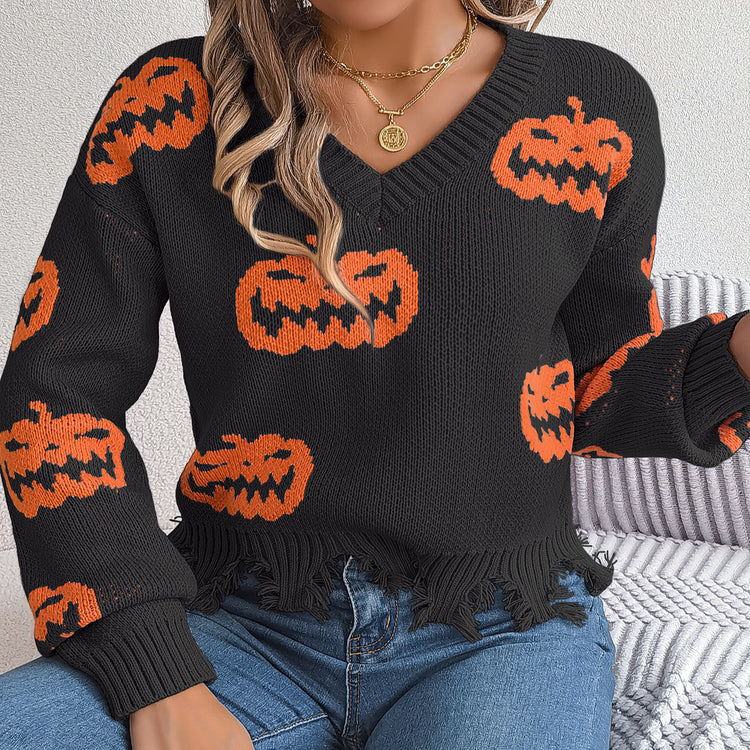 a woman wearing a sweater with pumpkins on it