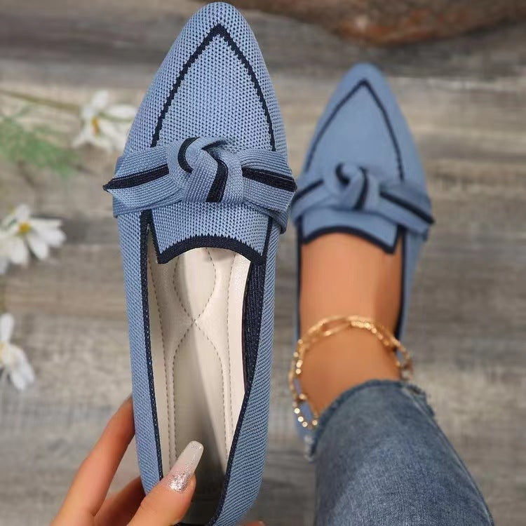 a person holding a shoe