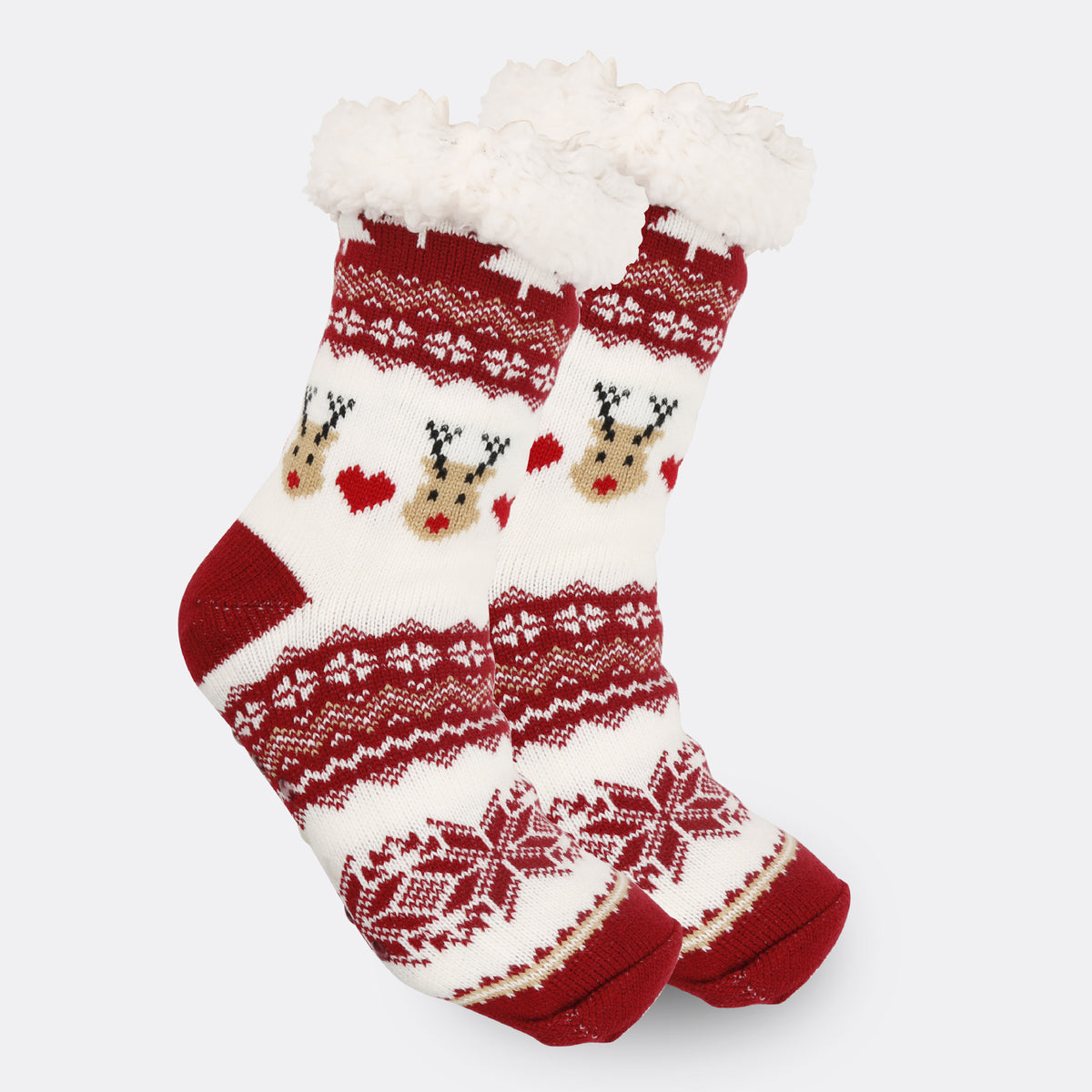 a pair of red and white socks with reindeer designs