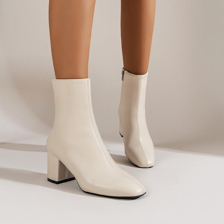 a person wearing white boots