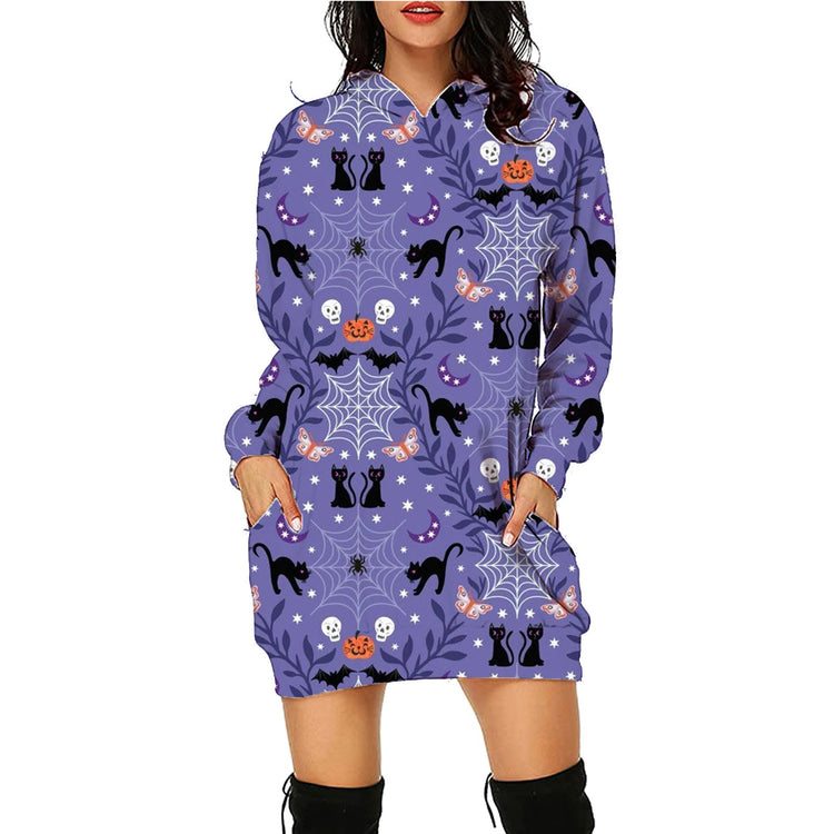 a woman wearing a purple dress with black cats and spiders