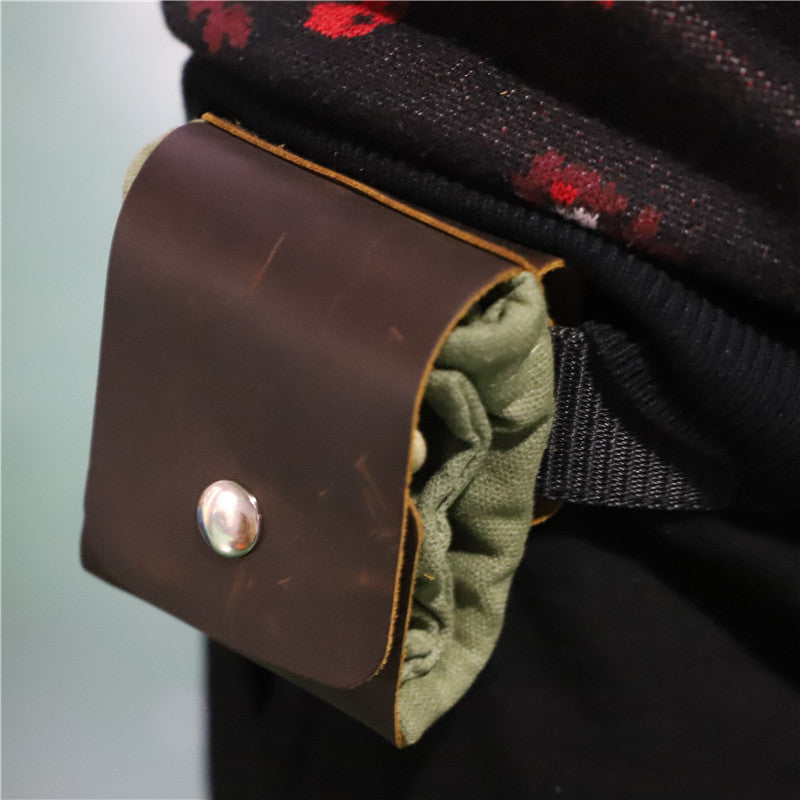 a leather pouch on a person's waist