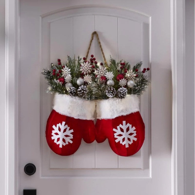 a pair of mittens on a door