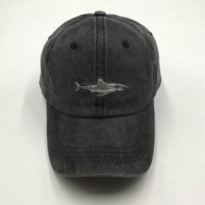 a black baseball cap with a shark on it