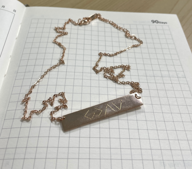 a gold necklace on a chain