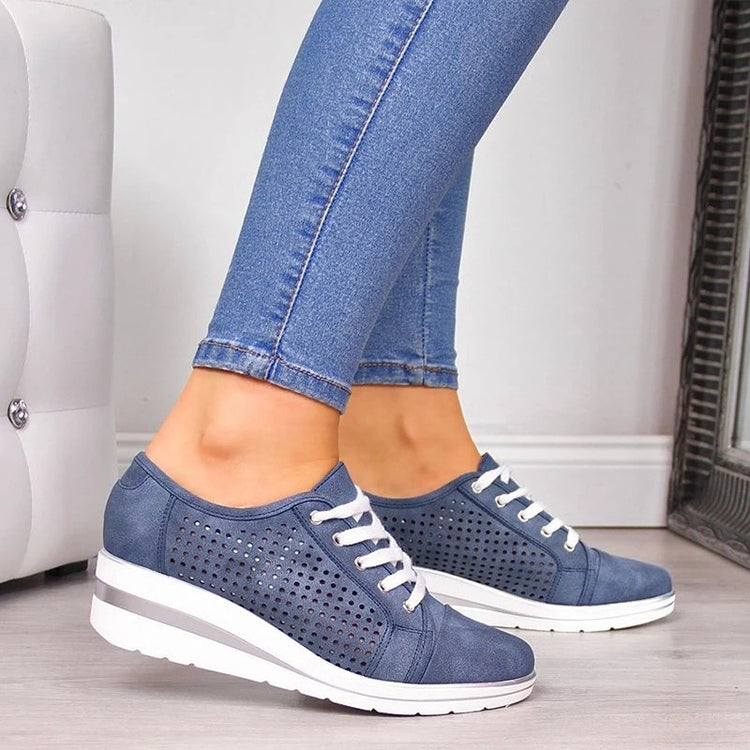 a pair of legs in jeans and blue shoes