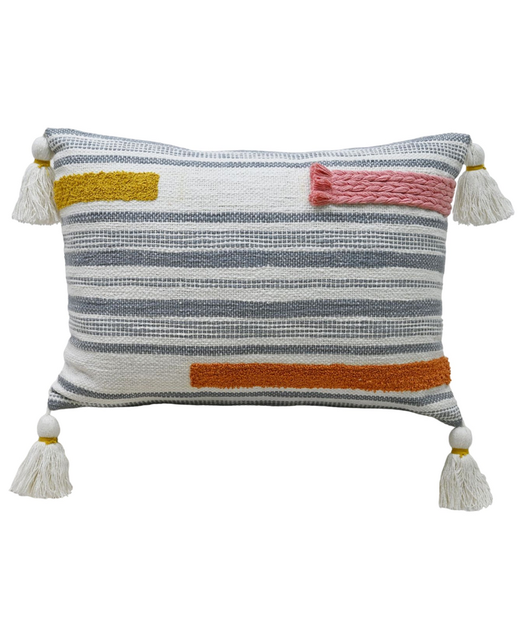 a pillow with tassels on it