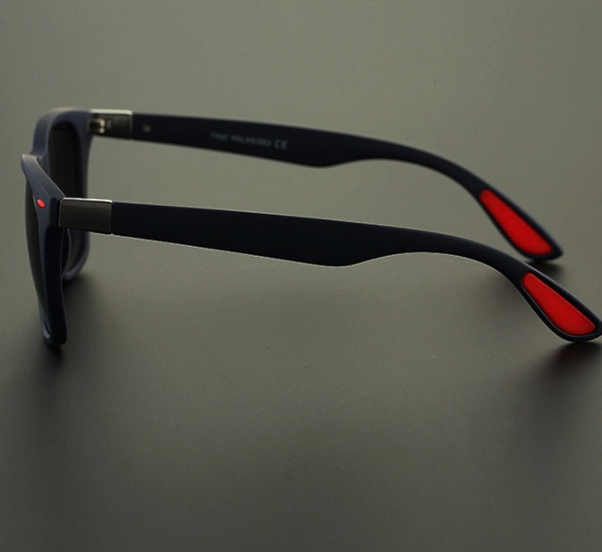 a pair of sunglasses on a black surface