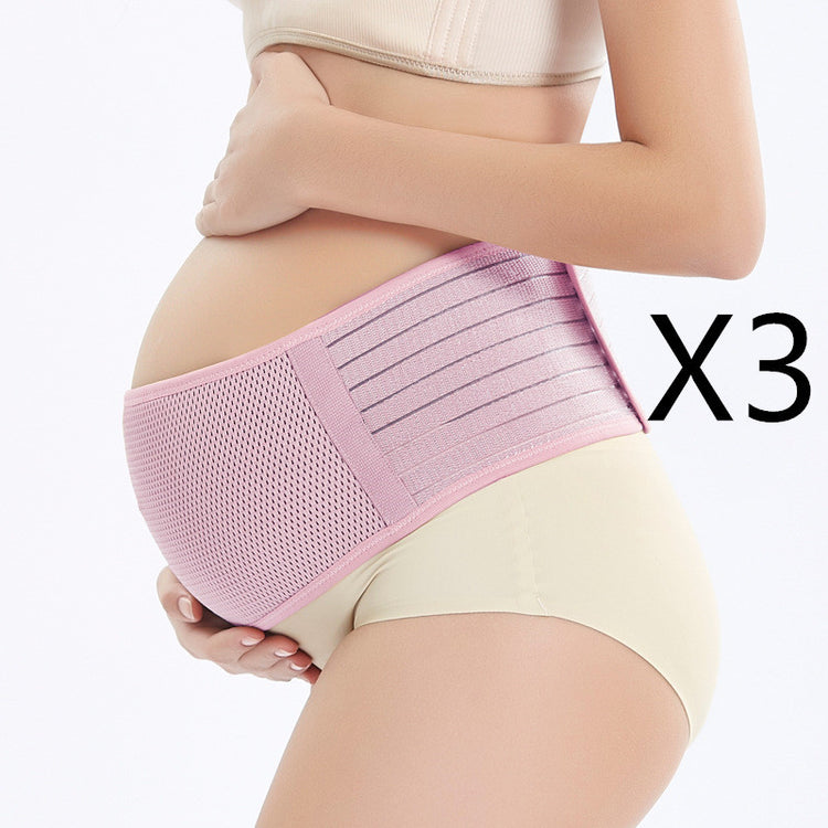 a pregnant woman wearing a pink belly band