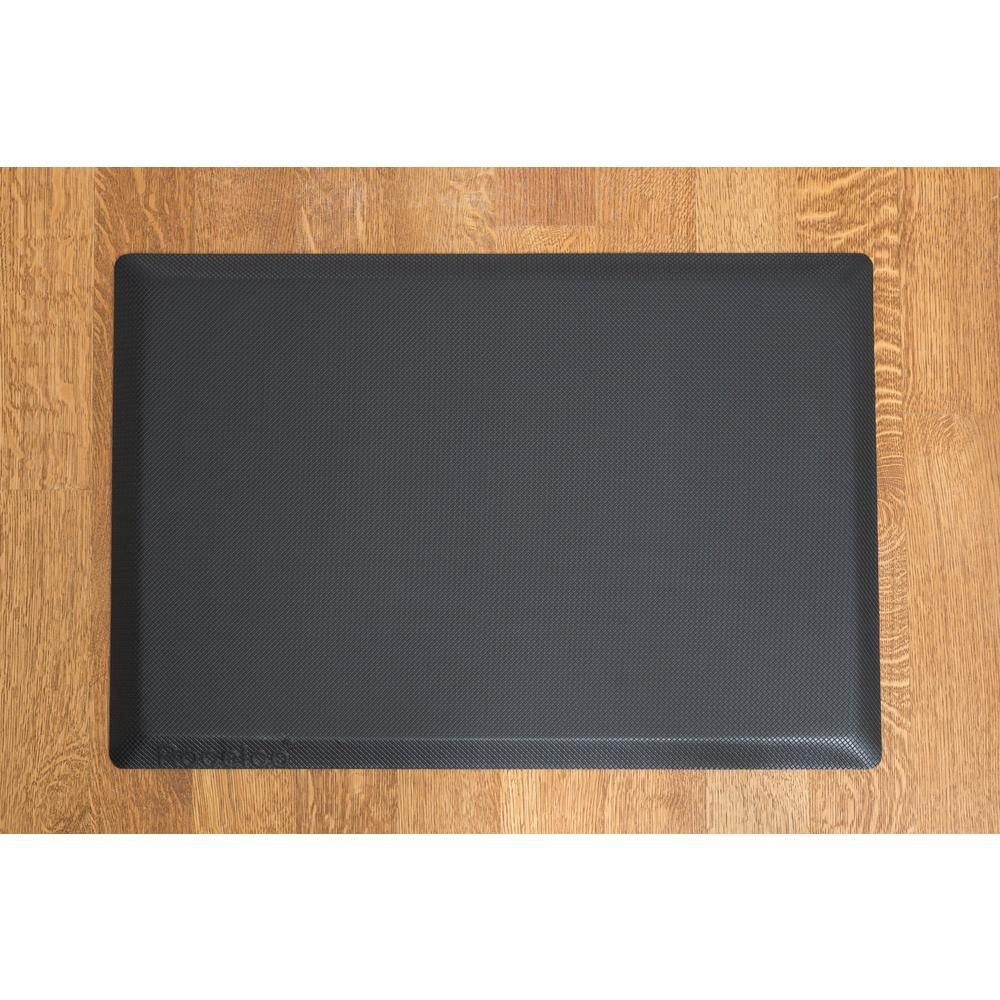 a black rectangular object on a wooden surface